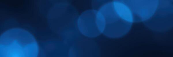 Soft blue bokeh lights create a calming atmosphere at night during a social gathering photo