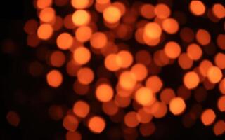 Warm glowing bokeh lights create a cozy atmosphere during a festive evening gathering photo