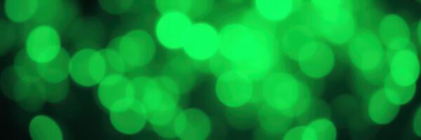 Colorful green bokeh lights create a vibrant atmosphere during a festive celebration at night photo
