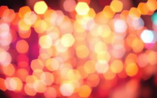 Colorful bokeh lights create a vibrant atmosphere at a nighttime celebration in the city photo