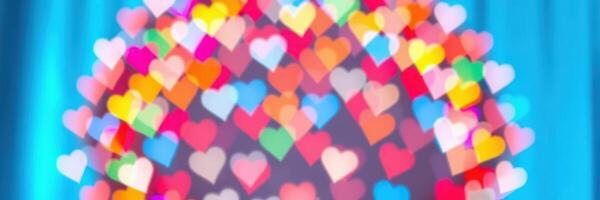 Colorful heart shapes illuminated against a blue background create a festive atmosphere for celebrations photo