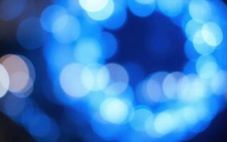 Colorful blue bokeh lights create an enchanting atmosphere during evening festivities photo