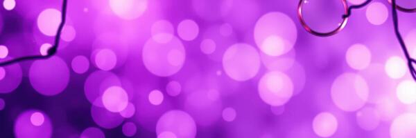 Vibrant purple bokeh lights create a lively background in a festive atmosphere suitable for celebrations photo