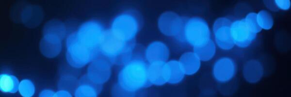 Illuminating blue bokeh lights create a mesmerizing atmosphere during evening events and celebrations in urban settings photo