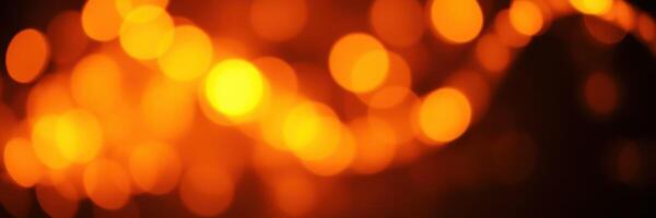 Warm orange bokeh lights create a cozy atmosphere for evening gatherings during autumn festivities photo