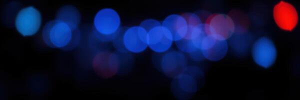Colorful bokeh lights create an abstract display at a festive nighttime event in the city photo