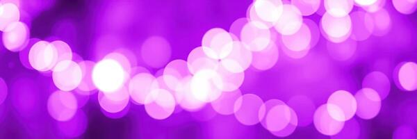 Purple bokeh lights create a magical atmosphere during an evening celebration in an urban setting photo