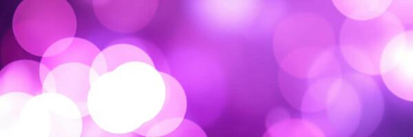 Colorful bokeh background with purple and white circles illuminating the atmosphere photo