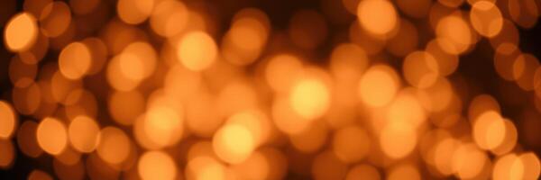 Bright orange bokeh lights create a warm atmosphere during a festive celebration at night photo