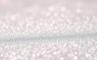 Glimmering silver particles create a dreamy and ethereal atmosphere in a softly lit setting photo