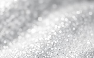 Sparkling silver glitter creates a mesmerizing effect in a soft, blurred background filled with radiance photo