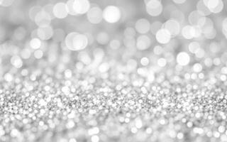 Sparkling silver glitter fills the surface, reflecting light and creating a shimmering effect during a special event or celebration photo