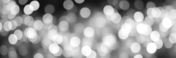 Sparkling bokeh lights create a dreamy atmosphere at a festive evening gathering photo