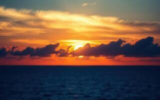 Vibrant sunset over ocean horizon with colorful clouds in the sky on a serene evening photo