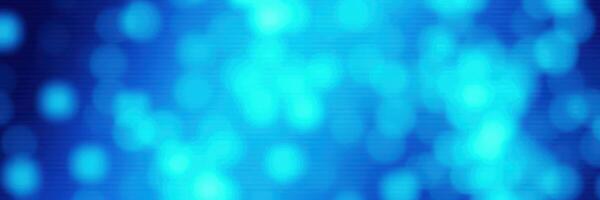 Soft blue bokeh lights create a dreamy atmosphere in this artistic depiction of shimmering colors photo