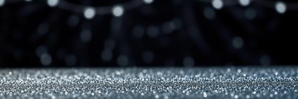 Sparkling surface with blurred lights in the background creating a festive atmosphere photo
