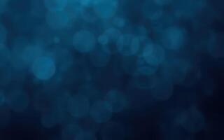 Abstract blue bokeh background creates a serene and calming effect suitable for various design projects photo