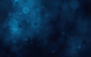 Swirling blue abstract background with soft glowing particles and bokeh effects in a digital design photo