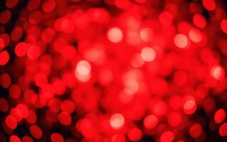Vibrant red bokeh lights create an enchanting atmosphere during the holiday season photo