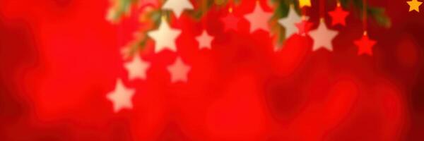 Festive decoration with colorful stars hanging against a vibrant red background during a holiday celebration photo
