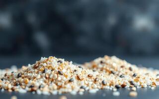 Harvested seeds in mounds with earthy tones on a dark surface showcasing natural textures and colors photo