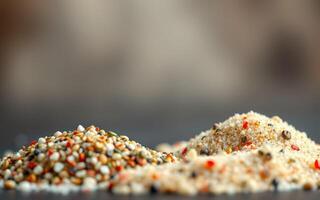 Different types of spices and seasonings displayed on a wooden surface in a kitchen setting photo