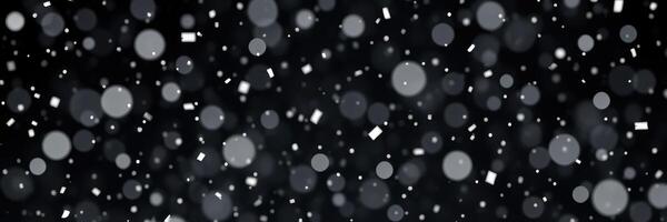 Snowfall creates a serene winter atmosphere with falling flakes and shimmering light in a night sky photo