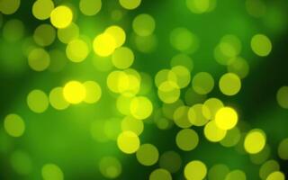 Vibrant green background with glowing yellow bokeh lights creating a festive atmosphere for celebrations or events photo