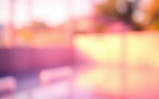 Abstract blurred background with warm colors reflecting soft light during sunset at an outdoor location photo