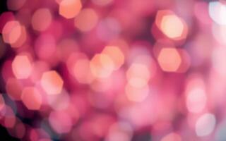 Vibrant pink bokeh lights create a dreamy atmosphere at an evening celebration photo
