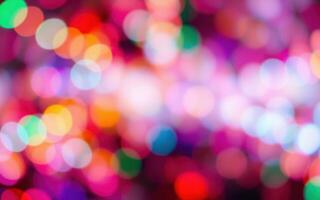 Colorful bokeh lights create a festive atmosphere during a celebration in the evening photo