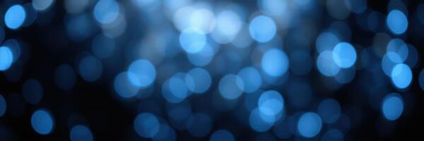 Abstract blue bokeh lights creating a magical atmosphere during a nighttime event photo