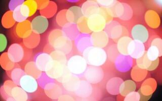 Colorful bokeh lights create a vibrant atmosphere at a festive event during an evening celebration photo