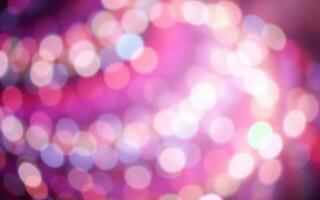 Colorful bokeh lights create a dreamy atmosphere at a night event with vibrant colors and soft focus effects photo
