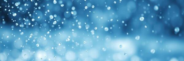 Close-up view of water droplets creating a shimmering effect in a blue environment during a rainy day photo