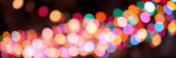 Colorful bokeh of festive lights creating a vibrant atmosphere during a celebratory evening in an urban setting photo