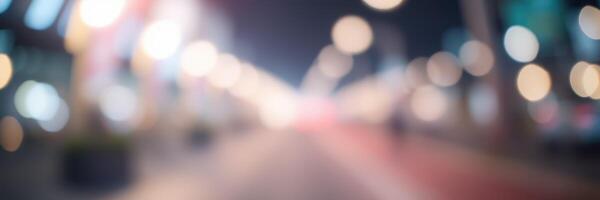 City street illuminated by vibrant lights during nighttime with a soft focus effect creating a dreamy atmosphere photo