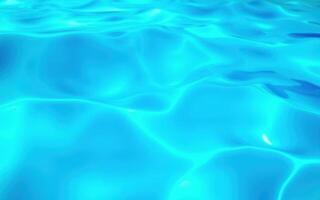 Vibrant blue water surface with gentle ripples in a serene swimming pool on a sunny day photo