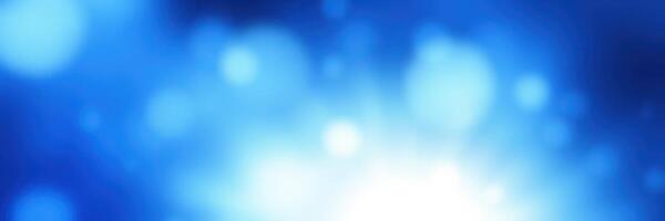 Vibrant blue abstract background featuring soft glowing bokeh lights creating a serene atmosphere photo