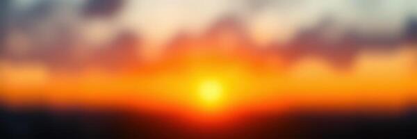 Vibrant sunset over the horizon with colorful clouds reflecting warm light in the evening sky photo