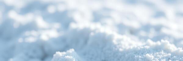 Snow blankets the ground, creating a serene winter landscape in a snowy environment filled with texture and soft brightness photo