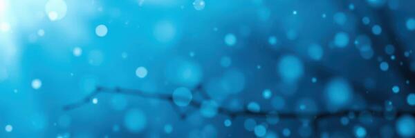 Soft blue bokeh background with light reflections creating a tranquil atmosphere photo