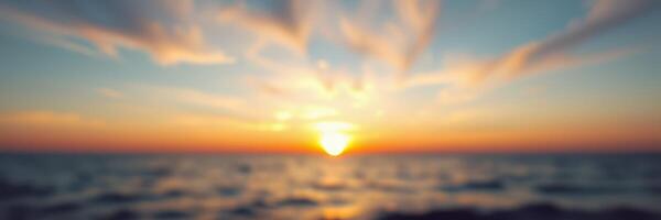 Beautiful sunrise over calm ocean waves casting vibrant colors in the sky during a peaceful morning photo