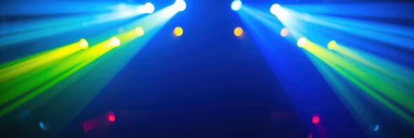 Colorful light beams illuminate a dark venue during an energetic music performance at night photo
