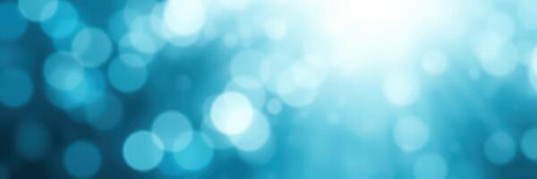 Soft blue bokeh background creates a calming atmosphere for creative projects and presentations photo