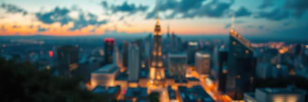 City skyline at dusk showing lights and buildings under a colorful sky filled with clouds photo