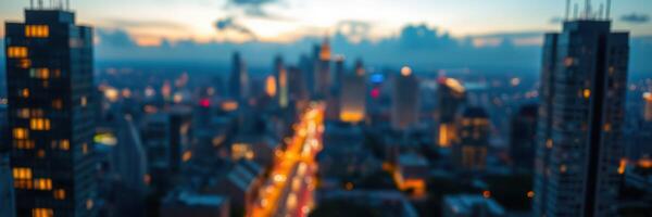 City skyline illuminated at dusk with vibrant lights and urban landscape captured from above photo