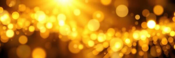 Golden particles illuminate a dark background creating a magical atmosphere photo