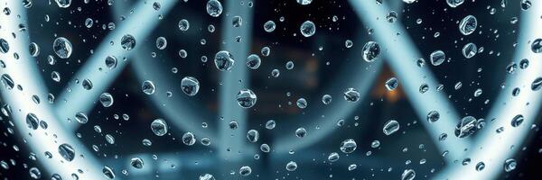 Close-up view of water droplets on glass illuminated by neon light in a modern urban environment photo