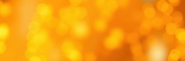 Bright orange bokeh lights create a warm and inviting atmosphere in a festive setting during the evening hours photo